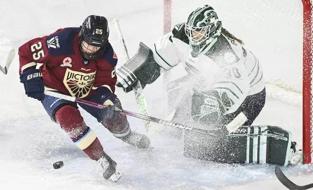 Montreal Victoire's Lina Ljungblom (25) moves in on Boston Fleet goaltender Emma Soderberg during second period PWHL hockey action in Laval, Que., Monday, Dec. 30, 2024. (Graham Hughes/The Canadian Press, via AP)