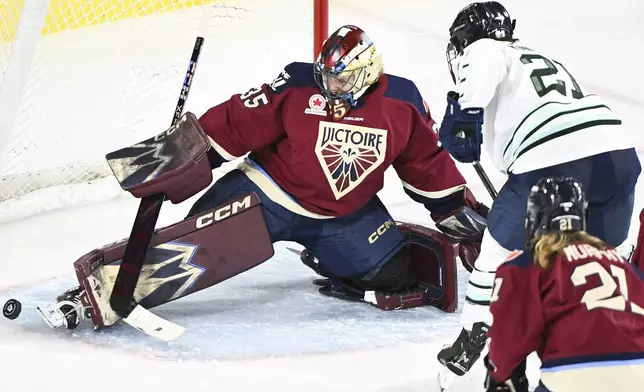 Montreal Victoire goaltender Ann-Renee Desbiens (35) stops Boston Fleet's Hilary Knight during second period PWHL hockey action in Laval, Que., Monday, Dec. 30, 2024. (Graham Hughes/The Canadian Press, via AP)