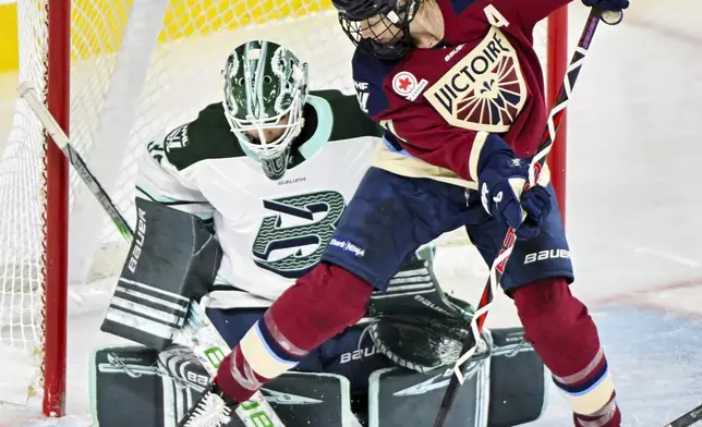 Montreal Victoire's Laura Stacey (7) moves in against Boston Fleet goaltender Emma Soderberg, left, during first-period PWHL hockey game action in Laval, Quebec, Monday, Dec. 30, 2024. (Graham Hughes/The Canadian Press via AP)