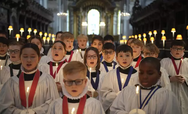 The Choristers of St Paul's choir, including girls for first time in 900-year history, rehearse for the Christmas services in St Paul's Cathedral, in London, Monday, Dec. 23 2024. (AP Photo/Kin Cheung)