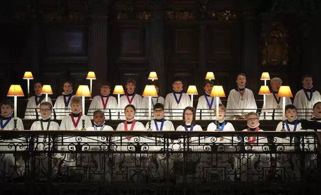 The Choristers of St Paul's choir, including girls for first time in 900-year history, rehearse for the Christmas services in St Paul's Cathedral, in London, Monday, Dec. 23 2024. (AP Photo/Kin Cheung)