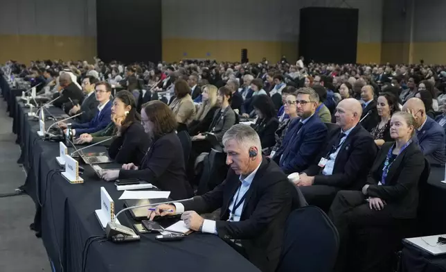 Delegates attend a plenary of the fifth session of the Intergovernmental Negotiating Committee on Plastic Pollution in Busan, South Korea, Sunday, Dec. 1, 2024. (AP Photo/Ahn Young-joon)