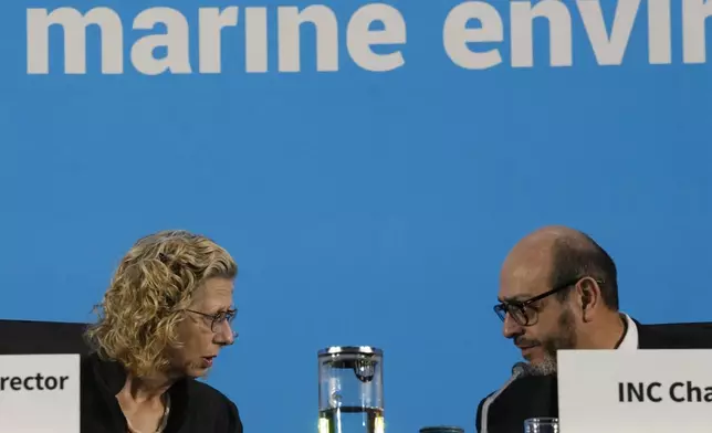 Chair of the International Negotiating Committee, Luis Vayas Valdivieso, right, speaks with Inger Andersen, Executive Director of UNEP, before the start of a plenary of the fifth session of the Intergovernmental Negotiating Committee on Plastic Pollution in Busan, South Korea, Sunday, Dec. 1, 2024. (AP Photo/Ahn Young-joon)