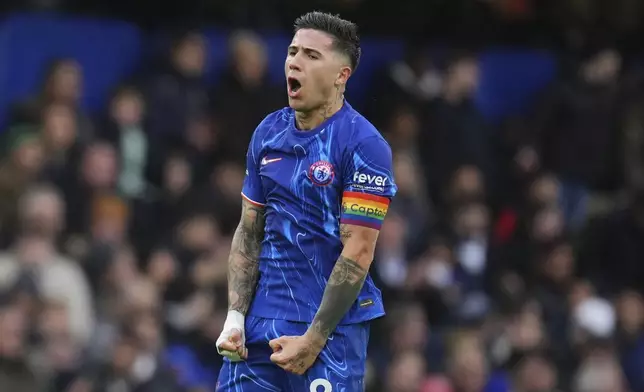 Chelsea's Enzo Fernandez celebrates after scoring his side's second goal during the English Premier League soccer match between Chelsea and Aston Villa at the Stamford Bridge stadium in London, Sunday, Dec. 1, 2024. (AP Photo/Kirsty Wigglesworth)