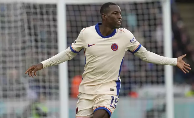 Chelsea's Nicolas Jackson celebrates after scoring the opening goal during the English Premier League soccer match between Leicester City and Chelsea at King Power stadium in Leicester, England, Saturday, Nov. 23, 2024. (AP Photo/Dave Shopland)