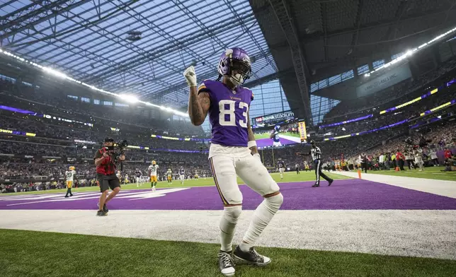 Minnesota Vikings' Jalen Nailor reacts after catching a touchdown pass during the first half of an NFL football game against the Green Bay Packers Sunday, Dec. 29, 2024, in Minneapolis. (AP Photo/Abbie Parr)