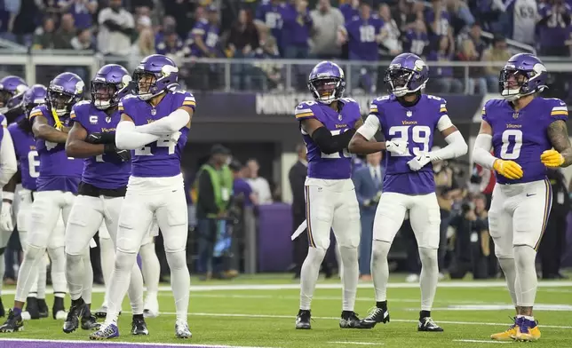 Minnesota Vikings' Camryn Bynum celebrates his fumble recovery with teammates during the first half of an NFL football game against the Green Bay Packers Sunday, Dec. 29, 2024, in Minneapolis. (AP Photo/Abbie Parr)