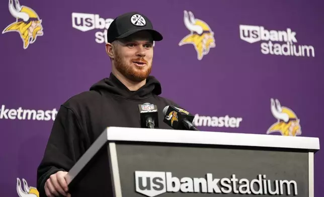 Minnesota Vikings' Sam Darnold talks after an NFL football game against the Green Bay Packers Sunday, Dec. 29, 2024, in Minneapolis. (AP Photo/Abbie Parr)