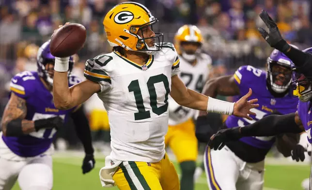 Green Bay Packers' Jordan Love throws during the second half of an NFL football game against the Minnesota Vikings Sunday, Dec. 29, 2024, in Minneapolis. (AP Photo/Bruce Kluckhohn)