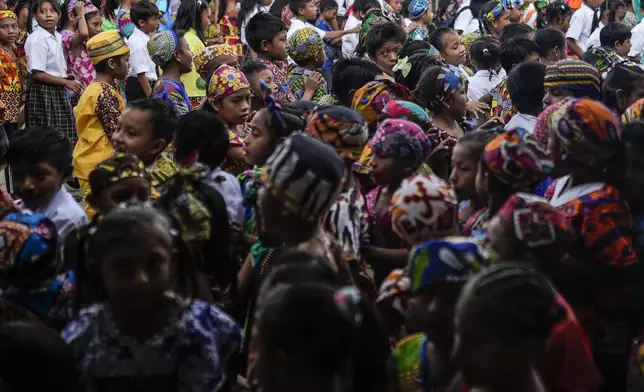 Children line up to enter school on Gardi Sugdub Island, part of the San Blas archipelago off Panama's Caribbean coast, May 27, 2024. (AP Photo/Matias Delacroix)