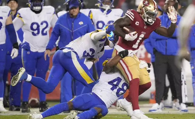 San Francisco 49ers wide receiver Deebo Samuel Sr. (1) runs against the Los Angeles Rams during the second half of an NFL football game in Santa Clara, Calif., Thursday, Dec. 12, 2024. (AP Photo/Godofredo A. Vásquez)