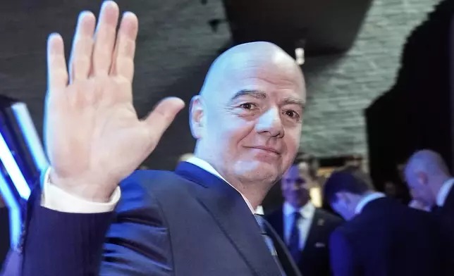 FIFA president Gianni Infantino waves at the UEFA Preliminary Draw for the 2026 FIFA World Cup at FIFA headquarters in Zurich, Switzerland, Friday, December 13, 2024. (AP Photo/Martin Meissner)