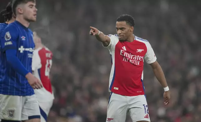 Arsenal's Jurrien Timber gestures during the English Premier League soccer match between Arsenal and Ipswich at the Emirates Stadium in London, Friday, Dec. 27, 2024. (AP Photo/Kin Cheung)