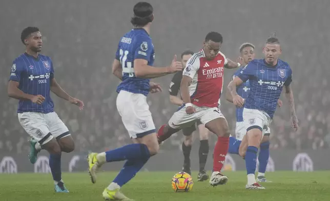 Arsenal's Jurrien Timber takes a shot during the English Premier League soccer match between Arsenal and Ipswich at the Emirates Stadium in London, Friday, Dec. 27, 2024. (AP Photo/Kin Cheung)