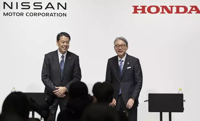 FILE - Nissan Chief Executive Makoto Uchida, left, and Honda President Toshihiro Mibe attend a joint news conference in Tokyo, Friday, March 15, 2024. (Kyodo News via AP, File)