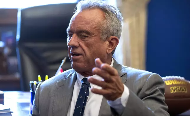 Robert Kennedy Jr., President-elect Donald Trump's pick to lead the Health and Human Services Department, meets with Sen. Tommy Tuberville, R-Ala., on Capitol Hill, Tuesday, Dec. 17, 2024, in Washington. (AP Photo/Mark Schiefelbein)