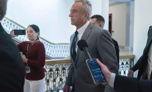 Robert F. Kennedy Jr., President-elect Donald Trump's nominee to be Secretary of Health and Human Services, walks to meet with Sen. Roger Marshall, R-Kan., at the Capitol in Washington, Tuesday, Dec. 17, 2024. (AP Photo/Jose Luis Magana)