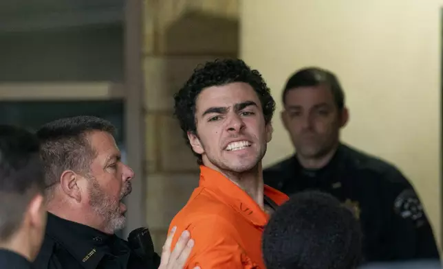 Suspect Luigi Mangione is taken into the Blair County Courthouse on Tuesday, Dec. 10, 2024, in Hollidaysburg, Pa. (Benjamin B. Braun/Pittsburgh Post-Gazette via AP)