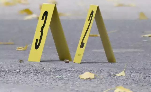 Bullets lie on the sidewalk at the scene outside the Hilton Hotel in midtown Manhattan where Brian Thompson, the CEO of UnitedHealthcare, was fatally shot, Wednesday, Dec. 4, 2024, in New York. (AP Photo/Stefan Jeremiah)