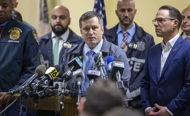 Altoona, Pa., Deputy Police Chief Derek Swope, center, speaks during a press conference regarding the arrest of suspect Luigi Mangione, Monday, Dec. 9, 2024, in Hollidaysburg, Pa., in the fatal shooting of UnitedHealthcare CEO Brian Thompson. (AP Photo/Ted Shaffrey)