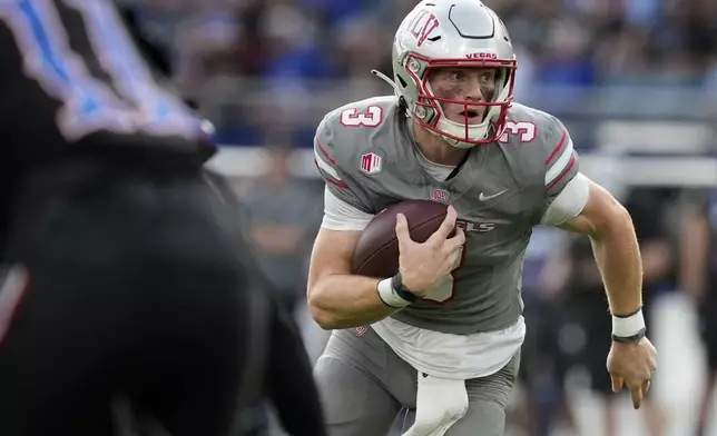 FILE - UNLV quarterback Matthew Sluka runs the ball against Kansas in the first half of an NCAA college football game Friday, Sept. 13, 2024, at Children's Mercy Park in Kansas City, Kan. (AP Photo/Ed Zurga, File)