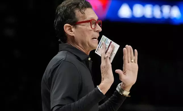 Atlanta Hawks head coach Quin Snyder speaks to his players during the first half of an NBA basketball game against the New Orleans Pelicans, Monday, Dec. 2, 2024, in Atlanta. (AP Photo/Mike Stewart)