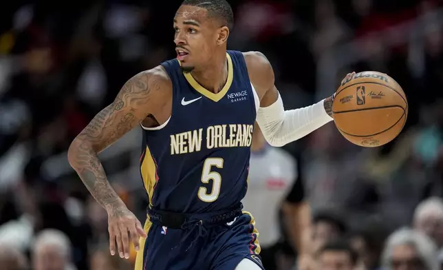 New Orleans Pelicans guard Dejounte Murray (5) moves the ball against the Atlanta Hawks during the first half of an NBA basketball game, Monday, Dec. 2, 2024, in Atlanta. (AP Photo/Mike Stewart)