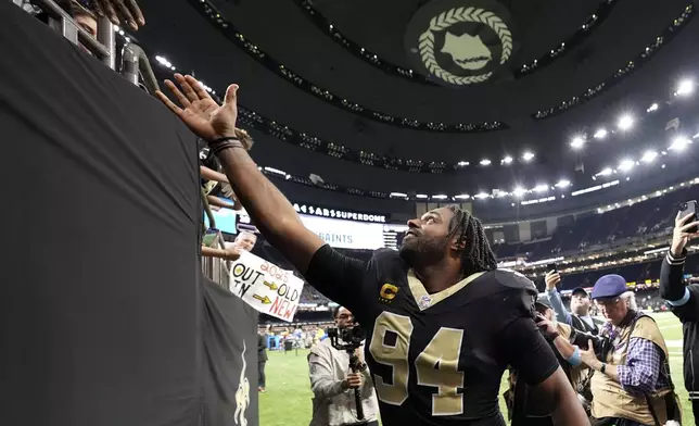 New Orleans Saints defensive end Cameron Jordan (94) reacts with fans after an NFL football game against the Las Vegas Raiders, Sunday, Dec. 29, 2024, in New Orleans. (AP Photo/Gerald Herbert)