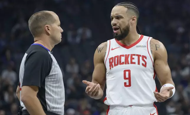 Houston Rockets forward Dillon Brooks (9) argues with referee John Goble after an official's call during the first half of an Emirates NBA Cup basketball game against the Sacramento Kings in Sacramento, Calif., Tuesday, Dec. 3, 2024. (AP Photo/Randall Benton)