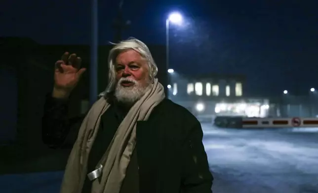 Environmental activist Paul Watson waves as he is released from prison in Nuuk, Greenland, Tuesday Dec. 17, 2024. (Alataq Moeller/Ritzau Scanpix via AP)