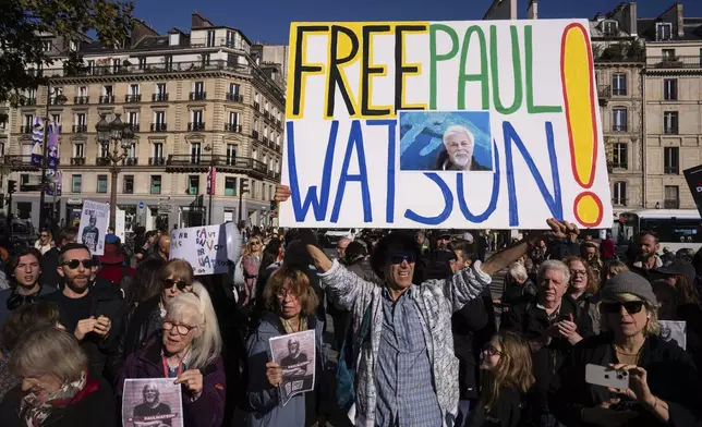 FILE - People demonstrate to support Sea Shepherd founder Paul Watson, known for his decades-long fight against Japanese whaling and arrested in Greenland, and who has asked France's president for political asylum, Wednesday, Oct. 23, 2024 in Paris. (AP Photo/Louise Delmotte, File)