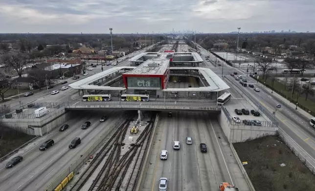 Cars pass the 95th Street Red Line Station, the train station currently the farthest south on the line and where the Chicago Transit Authority plans to extend from in 2025, Thursday, Dec. 19, 2024, in Chicago. (AP Photo/Erin Hooley)