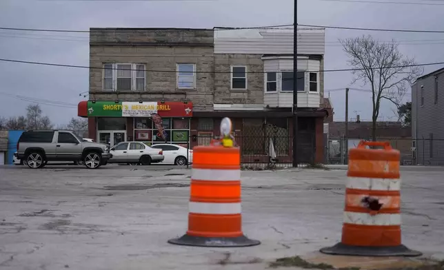 Buildings across from an empty lot where the Chicago Transit Authority plans to expand the Red Line train route sit along South Michigan Avenue, Wednesday, Dec. 11, 2024, in the Roseland neighborhood of Chicago. (AP Photo/Erin Hooley)