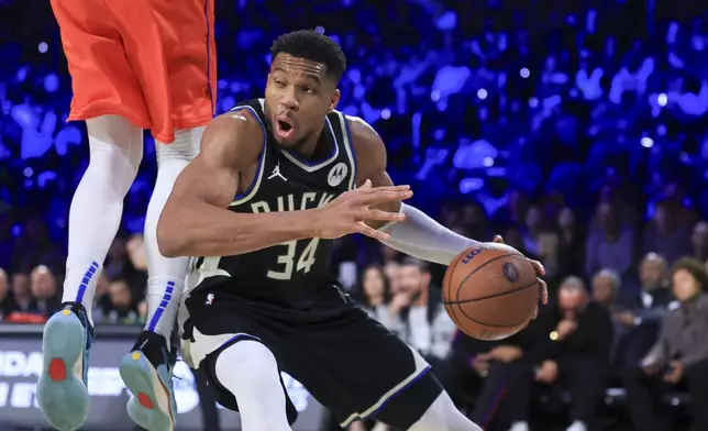 Milwaukee Bucks forward Giannis Antetokounmpo (34) drives against Oklahoma City Thunder center Isaiah Hartenstein (55) during the second half of the championship game in the NBA Cup basketball tournament Tuesday, Dec. 17, 2024, in Las Vegas. (AP Photo/Ian Maule)