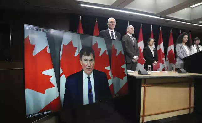 Canada Minister of Public Safety, Democratic Institutions and Intergovernmental Affairs Dominic LeBlanc speaks virtually at a press conference on new measures to strengthen gun control in Ottawa, Ontario, on Thursday, Dec. 5, 2024. (Patrick Doyle/The Canadian Press via AP)