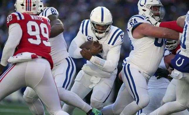 Indianapolis Colts quarterback Anthony Richardson (5) carries the ball for a touchdown during the first half of an NFL football game against the New England Patriots, Sunday, Dec. 1, 2024, in Foxborough, Mass. (AP Photo/Charles Krupa)