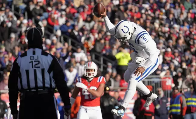 Indianapolis Colts quarterback Anthony Richardson (5) spikes the ball after his touchdown run during the first half of an NFL football game against the New England Patriots, Sunday, Dec. 1, 2024, in Foxborough, Mass. (AP Photo/Steven Senne)