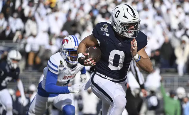 Penn State linebacker Dominic DeLuca returns an interception for a touchdown while being chased by SMU running back Brashard Smith during the first half in the first round of the NCAA College Football Playoff, Saturday, Dec. 21, 2024, in State College, Pa. (AP Photo/Barry Reeger)