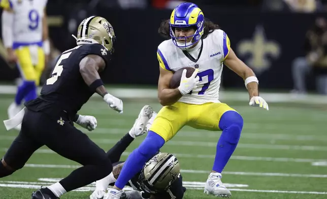 Los Angeles Rams wide receiver Puka Nacua (17) runs after a catch during the second half of an NFL football game against the New Orleans Saints Sunday, Dec. 1, 2024, in New Orleans. (AP Photo/Butch Dill)