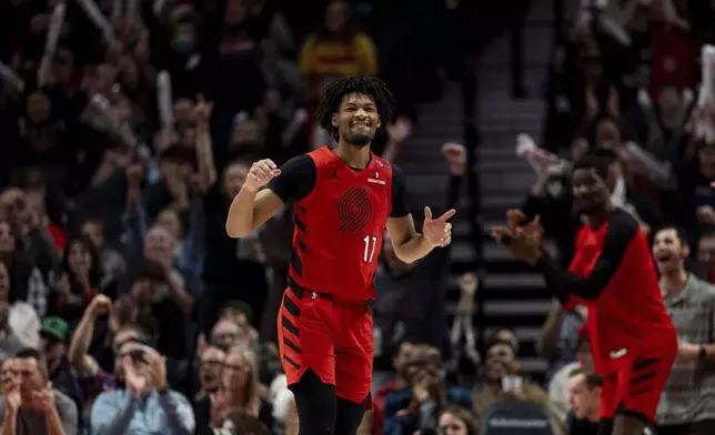 Portland Trail Blazers guard Shaedon Sharpe reacts to his shot against the Utah Jazz during the second half of an NBA basketball game Thursday, Dec. 26, 2024, in Portland, Ore. (AP Photo/Howard Lao)