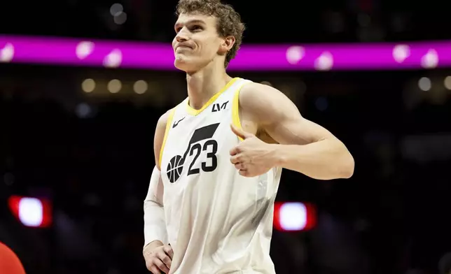 Utah Jazz forward Lauri Markkanen reacts to the foul call against the Portland Trail Blazers during the second half of an NBA basketball game, Thursday, Dec. 26, 2024, in Portland, Ore. (AP Photo/Howard Lao)