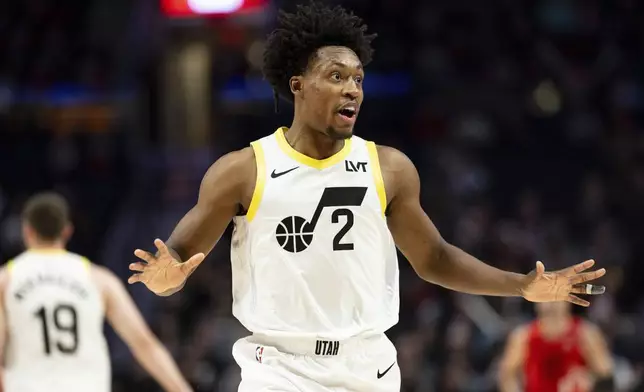 Utah Jazz guard Collin Sexton reacts after a basket against the Portland Trail Blazers during the first half of an NBA basketball game Thursday, Dec. 26, 2024, in Portland, Ore. (AP Photo/Howard Lao)