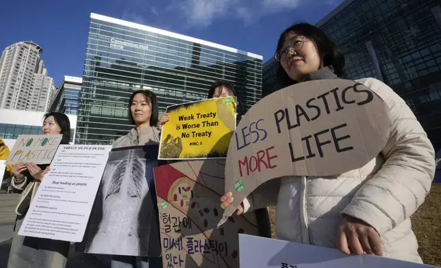 South Korean environment activists protest calling for a strong global plastics treaty outside of the venue for the fifth session of the Intergovernmental Negotiating Committee on Plastic Pollution in Busan, South Korea, Sunday, Dec. 1, 2024. (AP Photo/Ahn Young-joon)