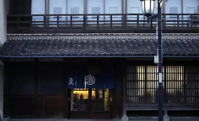 The storefront of the Koten sake brewery is seen in Okaya, central Japan, Friday, Nov. 29, 2024. (AP Photo/Hiro Komae)