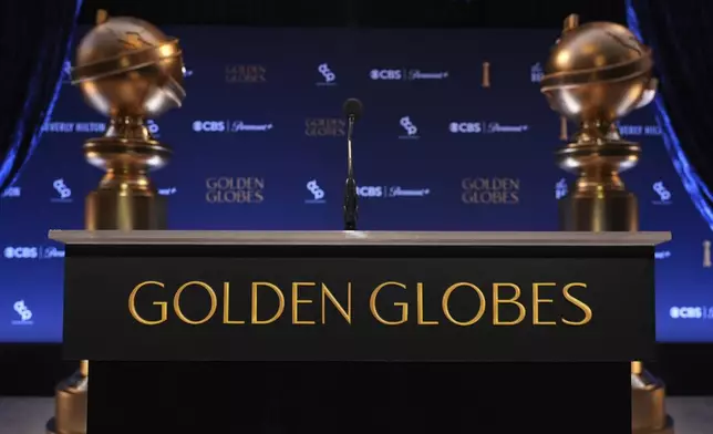 A podium and replicas of Golden Globe statues appear prior to the nominations announcement for the 82nd Golden Globes on Monday, Dec. 9, 2024, at the Beverly Hilton Hotel in Beverly Hills, Calif. The 82nd Golden Globes will be held on Sunday, Jan. 5, 2025. (AP Photo/Chris Pizzello)