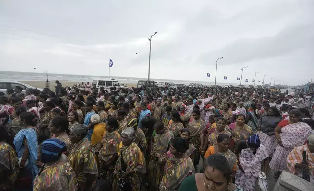 Indians gather to offer tributes in remembrance of victims of the 2004 tsunami on the 20th anniversary of the tragedy, at Marina Beach in Chennai, India, Thursday, Dec. 26, 2024. (AP Photo/Mahesh Kumar A.)