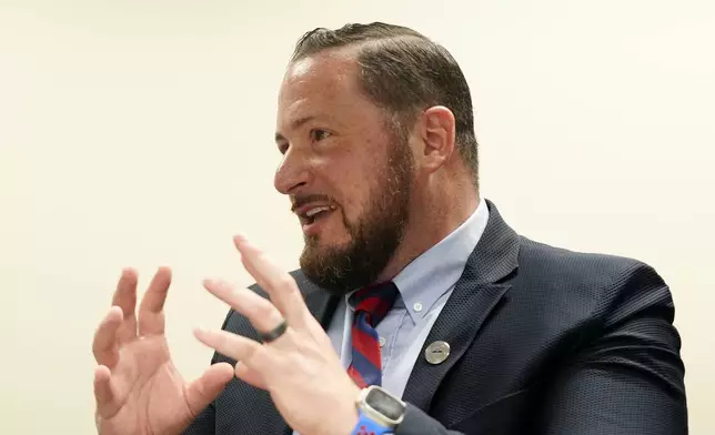 Nicholas Ferro, principal of Rice Intermediate School, talks about the student experience Tuesday, Aug. 27, 2024, in San Carlos, Ariz. (AP Photo/Ross D. Franklin)