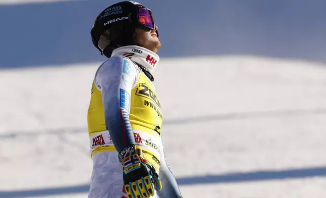 Norway's Atle Lie McGrath reacts at the finish area of an alpine ski, men's World Cup slalom, in Alta Badia, Italy, Monday, Dec. 23, 2024. (AP Photo/Alessandro Trovati)