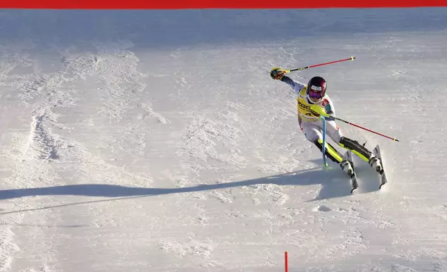 Norway's Atle Lie McGrath speeds down the course to cross the finish line of an alpine ski, men's World Cup slalom, in Alta Badia, Italy, Monday, Dec. 23, 2024. (AP Photo/Alessandro Trovati)