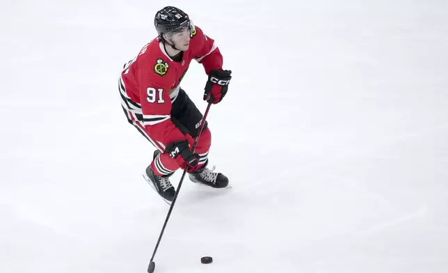 Chicago Blackhawks center Frank Nazar skates with the puck during the second period of an NHL hockey game against the Washington Capitals on Tuesday, Dec. 17, 2024, in Chicago. (AP Photo/Charles Rex Arbogast)